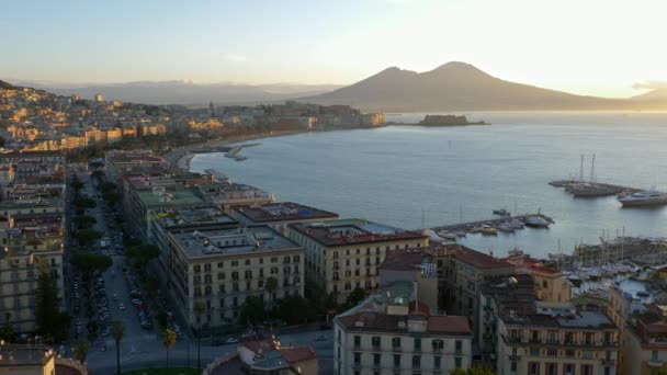 Picturesque sunrise in Naples, Italy. View of Vesuvius volcano. Panning shot, UHD — Stock Video