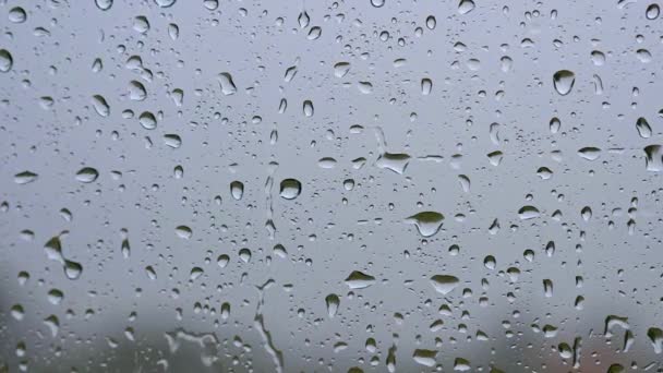 Window with raindrops during the rain. Slow motion shot — Stock Video