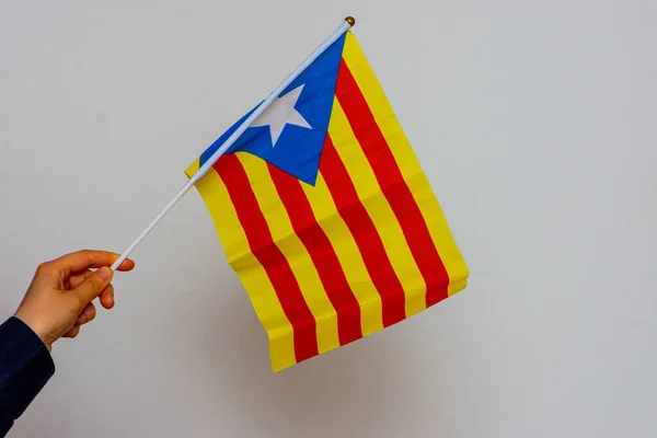 Catalonia flag held on the white background — Stock Photo, Image