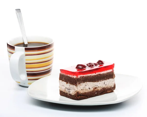 Kuchen mit einer Tasse Kaffee aus nächster Nähe — Stockfoto