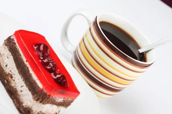 Pastel con una taza de café — Foto de Stock