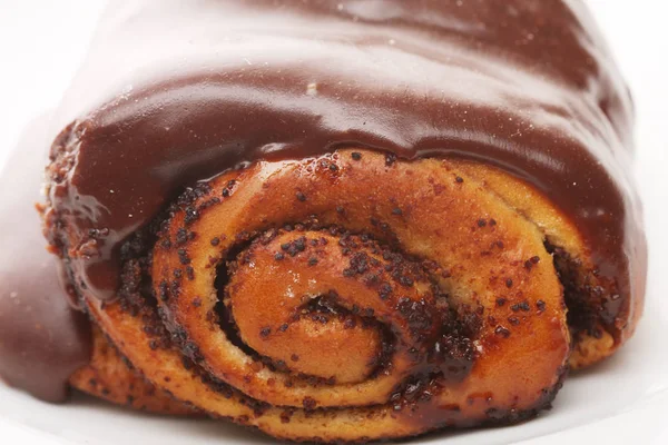 Bun with chocolate glaze — Stock Photo, Image