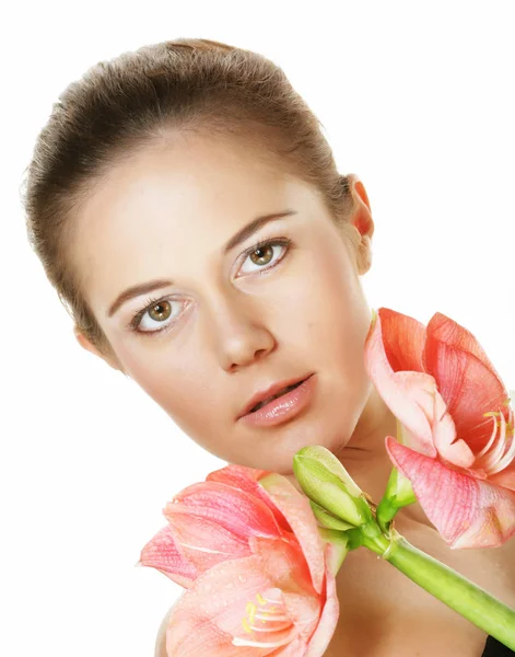 Beauty and fashion concept: young beautiful woman with big pink flowers — Stock Photo, Image