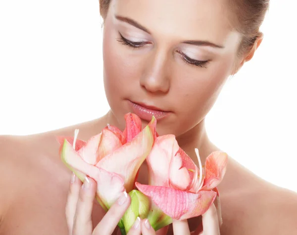 Beauty and fashion concept: young beautiful woman with big pink flowers Royalty Free Stock Photos