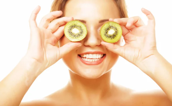 Healthy eating, food and diet concept - funny woman holding kiwi fruit for her eyes. — Stock Photo, Image