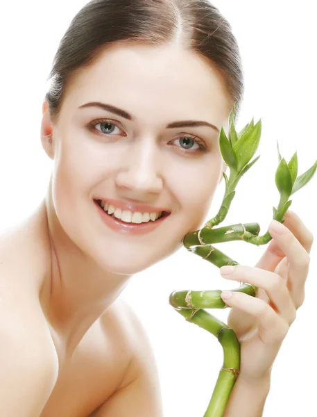 Young woman with bamboo over white background — Stock Photo, Image