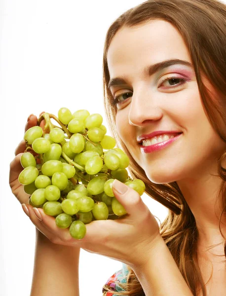 Portrait of a girl with a bunch of grapes isolated on white background — Stock Photo, Image