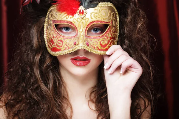 Woman with venetian masquerade carnival mask Stock Photo