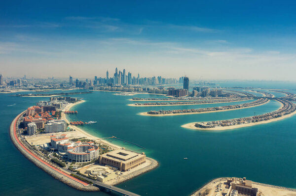 Aerial view on Palm Jumeirah island in Dubai, UAE, on a summer day.