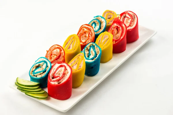 multi-colored multi-colored multi roll power source salad on a white plate on a white background