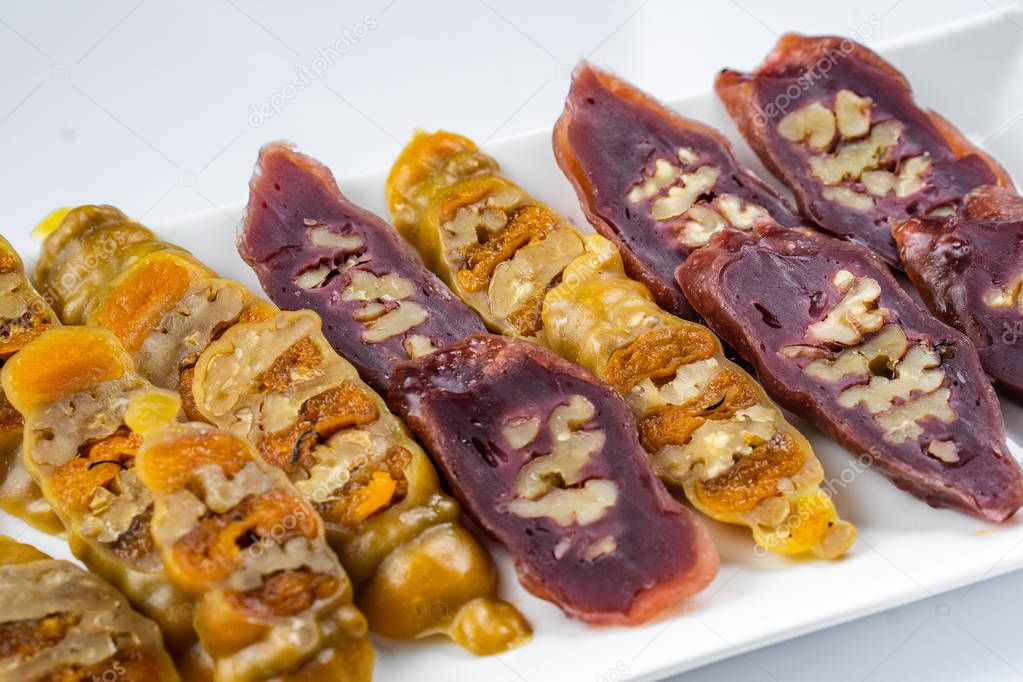 Tasty oriental sweets churchkhela , isolated on white, Georgia.