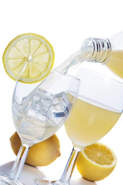 Lemon juice poured in glass — Stock Photo, Image