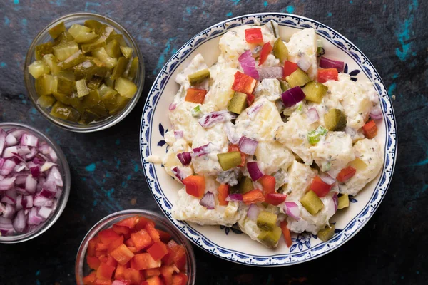 Potato salad with pickles, onion and mayonnaise dressing