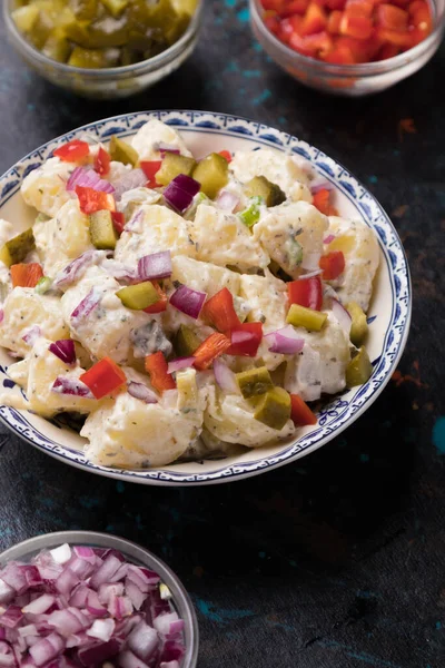 Potato salad with pickles, onion and mayonnaise dressing