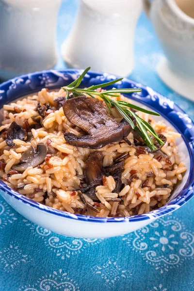 Risotto or cooked rice with mushrooms and vegetables