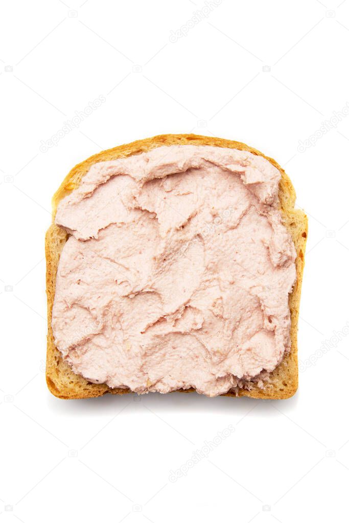 Slice of bread with spread on top isolated over white background