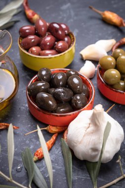Pickled olives ready to eat, healthy food used in mediterranean cuisines clipart