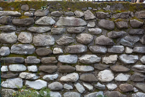 Old mossy stone wall