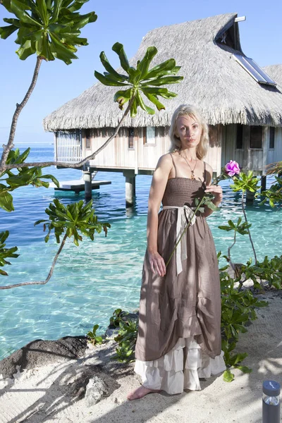 beautiful woman with a rose near a sea, Tahiti