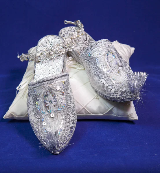 east style bride wedding shoes on a blue velvet