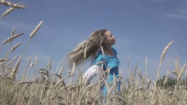 Happy Young Slender Woman Long Fair Hair Blue Dress Rotates — Stock Video