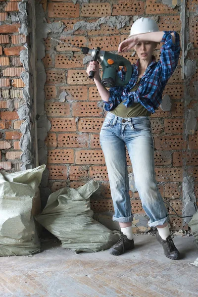 Tired Young Woman Work Clothes Protective Helmet Stands Front Brick — Stock Photo, Image