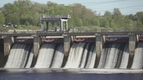 Slow motion of water dam drained from outlet pipe of the dam where is the hydropower electrical generation, Volkhov HYDROELECTRIC POWER station-hydro power station on river Volkhov, Russia, — Stock Video