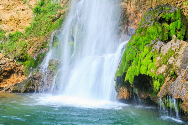 Beautiful waterfall in spring at daylight, forest stream creek, eastern Serbia, Europe
