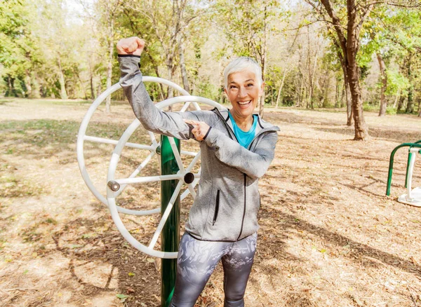 Portrait Happy Fit Senior Woman Exercise Outdoor Gym Sportswear Shows — Stock Photo, Image