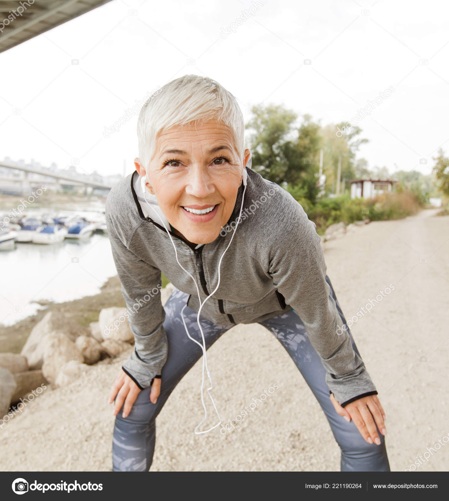 Senior Woman Relax Listening Music Earphones Running Gray Short