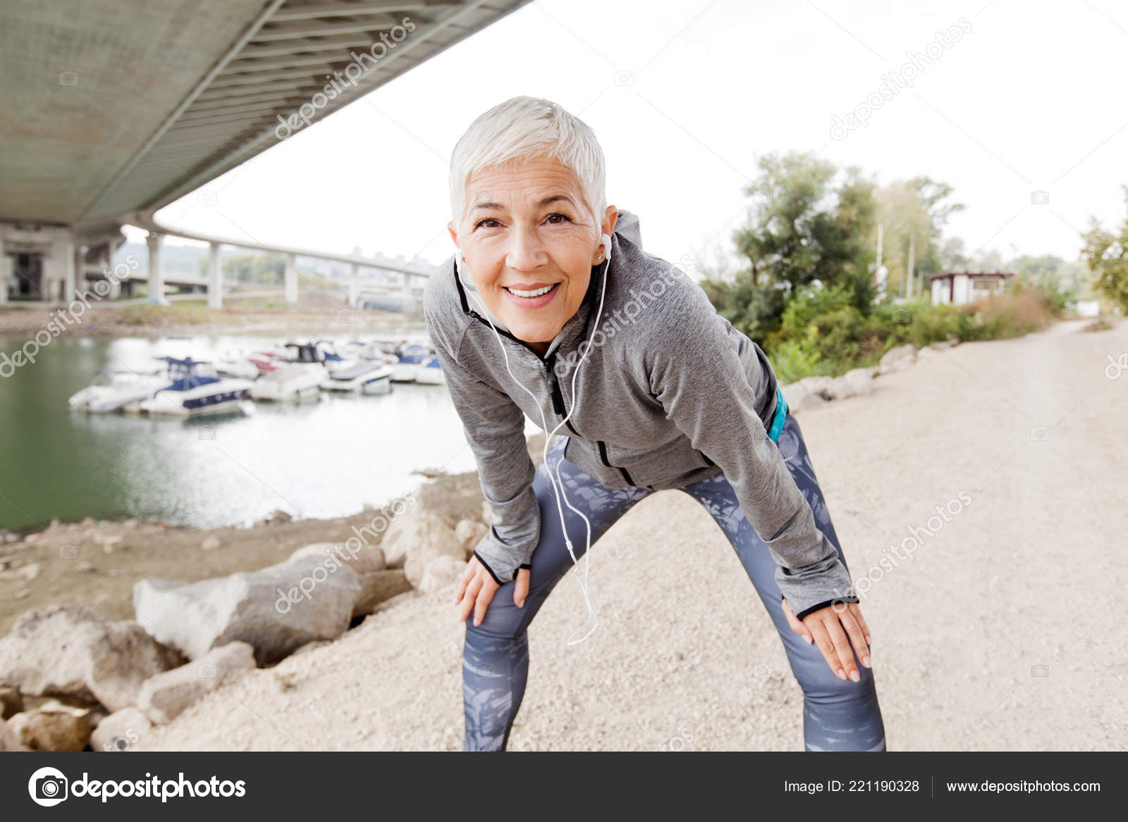 Senior Woman Relax Listening Music Earphones Running Gray Short