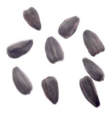 Beyaz arkaplanda izole edilmiş ayçiçeği tohumları