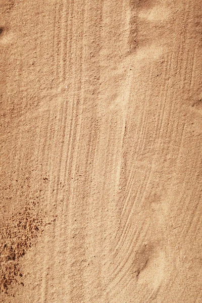 湿った砂を背景に — ストック写真