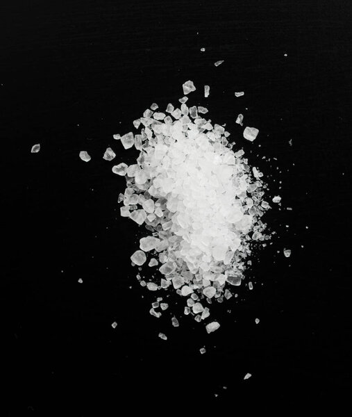 pile of salt on black background