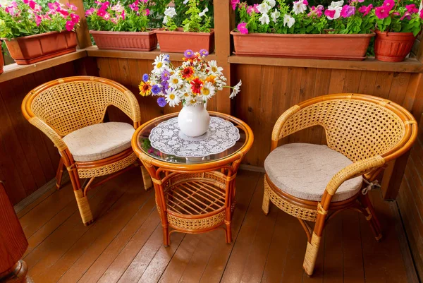 wooden terrace with garden furniture