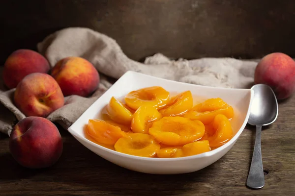bowl of canned peaches with fresh fruits