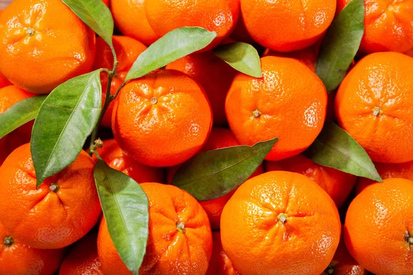 Fresh mandarin oranges fruit or tangerines as background, top vi