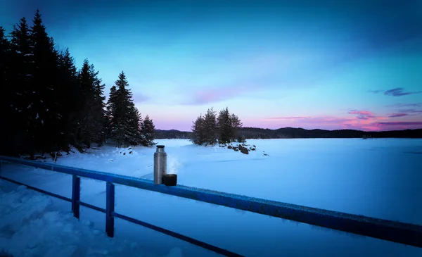 cold morning landscape, blue hour sunset near frozen lake, Bulgarian mountains
