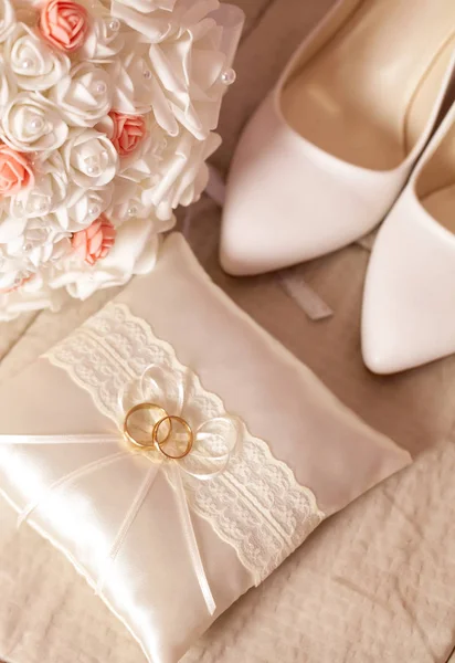 Wedding detail - shoes, rings and flowers on soft background Stock Image