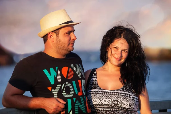 Happy Adult Couple Embracing Sunset Stock Photo