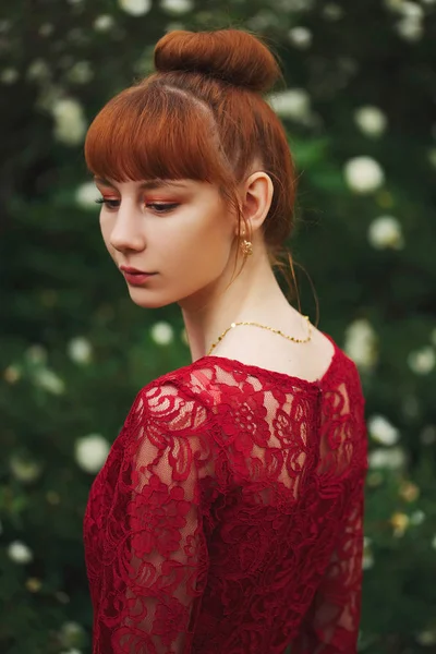 Beautiful red haired girl in park — Stock Photo, Image