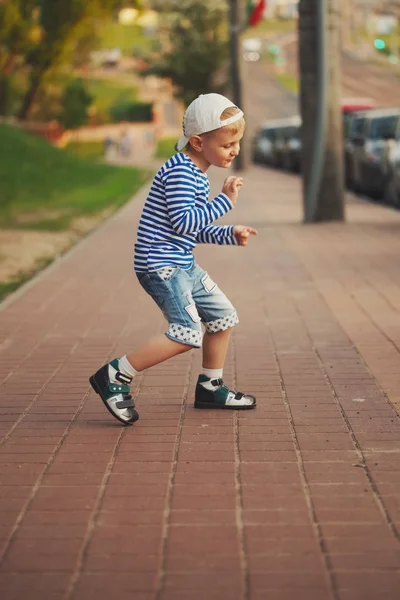 Little boy dancing on the street — Stock Photo, Image