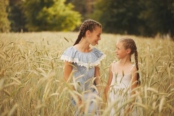 Young girl in the yellow field — Stock Photo, Image
