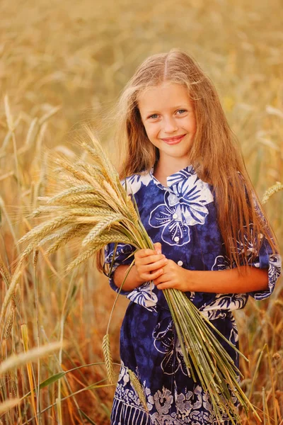 Young girl in the yellow field — Stock Photo, Image