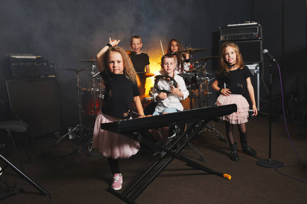 happy children singing and playing music