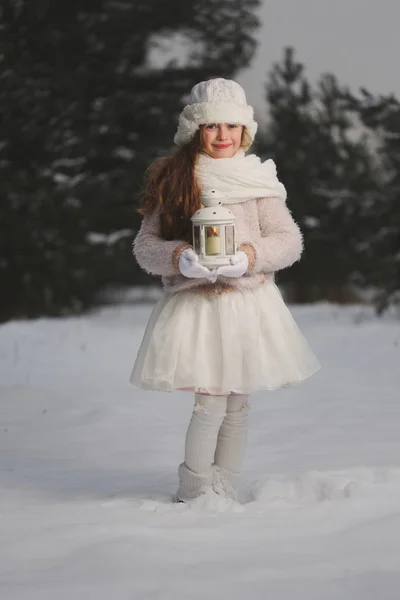 Little happy beautiful girl in winter forest — Stock Photo, Image