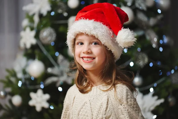 Little beautiful girl with red santa hat — Stock Photo, Image