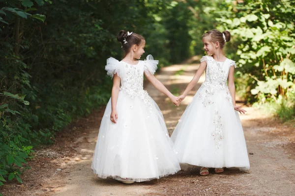 Happy beautiful girls with white wedding dresses — Stock Photo, Image