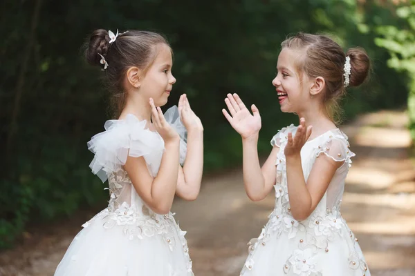 Happy beautiful girls with white wedding dresses — Stock Photo, Image