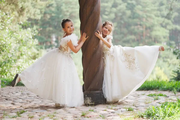 Happy beautiful girls with white wedding dresses — Stock Photo, Image